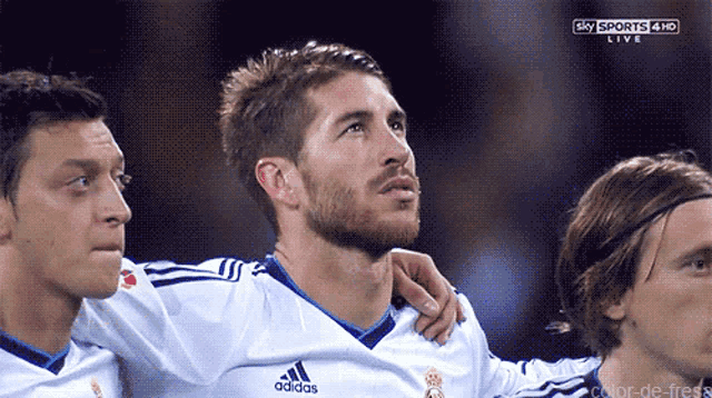 a soccer player wearing an adidas jersey looks up at the sky sports 4h live broadcast