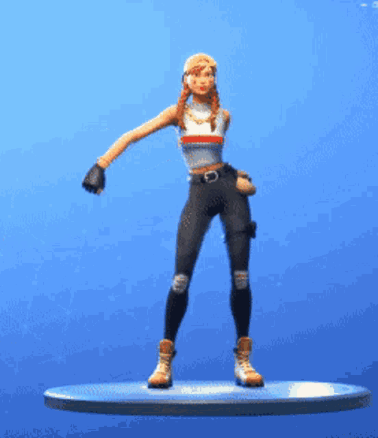 a figurine of a woman is standing on a platform with her arm outstretched