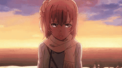 a girl wearing a scarf and a jacket is crying .