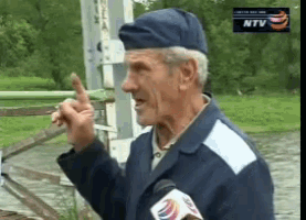 a man wearing a blue hat is talking into a microphone with a ntv logo in the corner