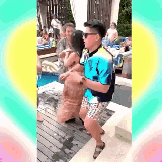 a man in a blue shirt and shorts is dancing with a woman