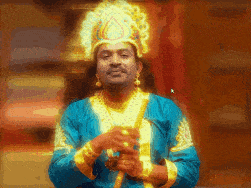 a man in a blue and gold costume with a gold crown