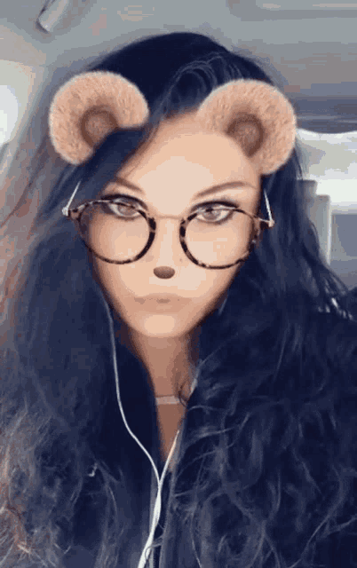 a woman wearing glasses and a teddy bear face mask