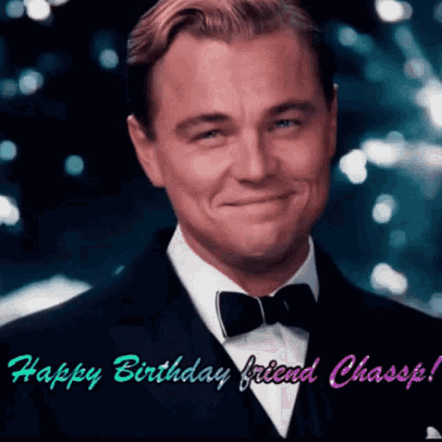 a man in a tuxedo and bow tie is smiling with the words happy birthday friend chassis behind him