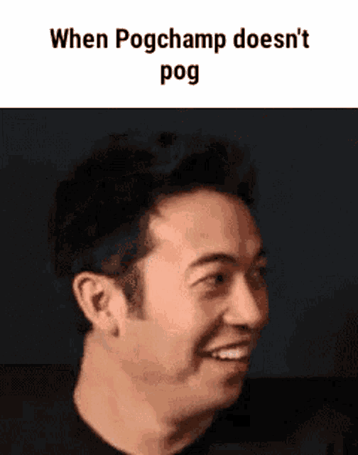 a man is smiling and making a funny face .