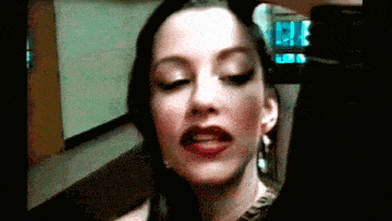 a close up of a woman with red lips