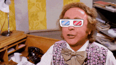 a man wearing 3d glasses with a bow tie