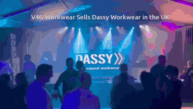 a group of people are standing in front of a stage that says dassy on it