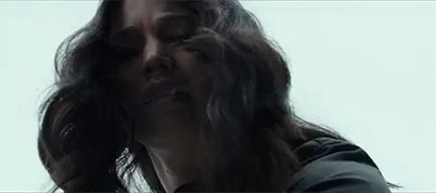 Katniss Picks Up White Rose GIF - Mockingjaypart1 Thehungergames Mockingjay GIFs