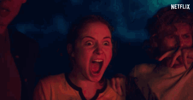 a man and a woman with their mouths open and a netflix logo behind them