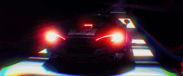 a car is driving through a dark tunnel with a rainbow of lights behind it