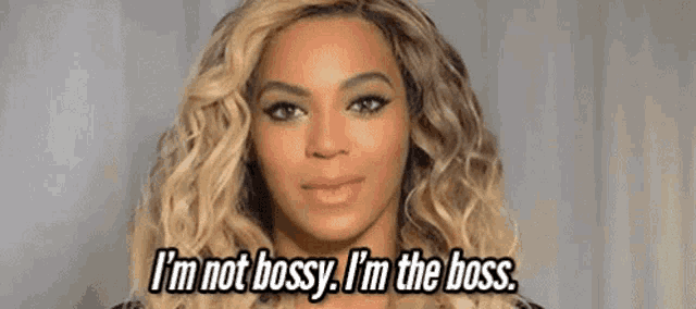 a woman with blonde hair is saying i 'm not bossy i 'm the boss .