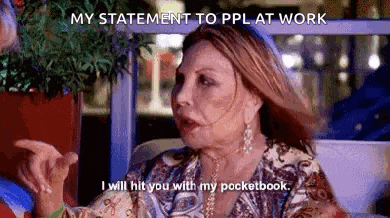 a woman is sitting on a couch talking to another woman and says `` my statement to ppl at work '' .