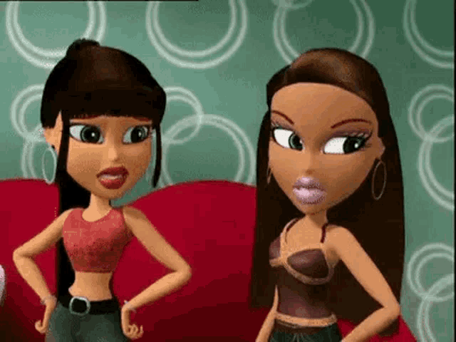 a couple of cartoon girls standing next to each other on a couch .