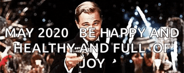 a man in a tuxedo is pointing at the camera with the words may 2020 be happy and healthy and full of joy below him