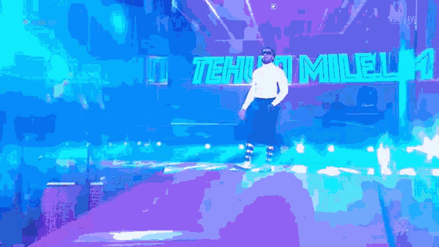 a man is standing in front of a sign that says teh t mile