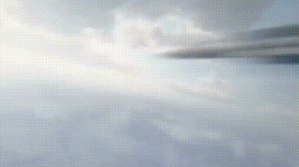 a jet is flying through a cloudy sky with a flame coming out of it 's tail .
