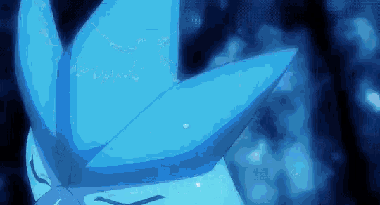a close up of a blue object in the dark with a blurred background .