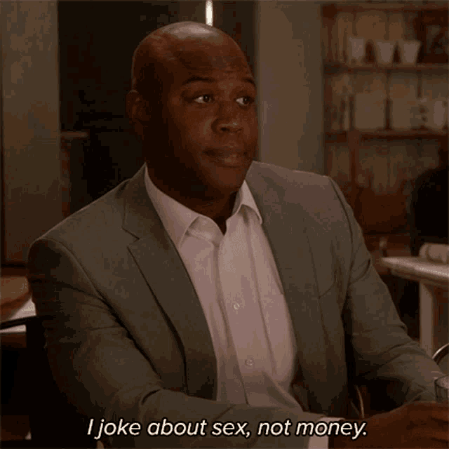 a man in a suit and white shirt says " i joke about sex not money "