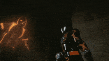 a smiley face is surrounded by flames in a circle