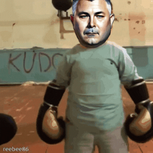 a man wearing boxing gloves stands in front of a wall that says kudo
