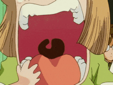a close up of a cartoon character 's mouth with a black s on it