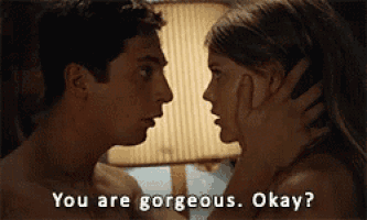 a man and a woman are kissing and the man is asking the woman if she is gorgeous okay .