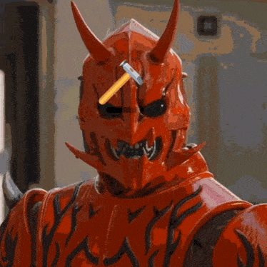 a drawing of a devil with horns and a pen in his mouth