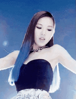 a woman with long blue hair is wearing a black top