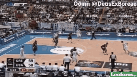 a basketball game is being played on a court with a crowd watching
