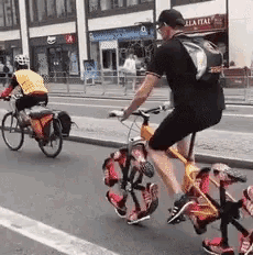 a man is riding a bike with a backpack on his back ..