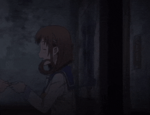 a girl in a school uniform is holding a pair of headphones