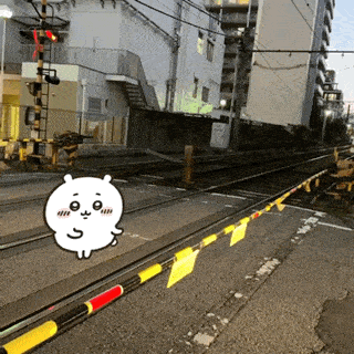 a cartoon of a bear standing on a railroad track