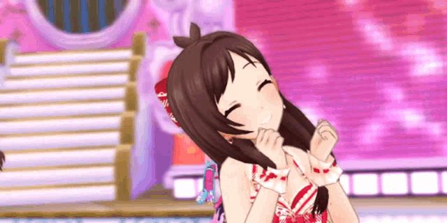 a girl in a red and white dress is smiling and making a heart with her hands .
