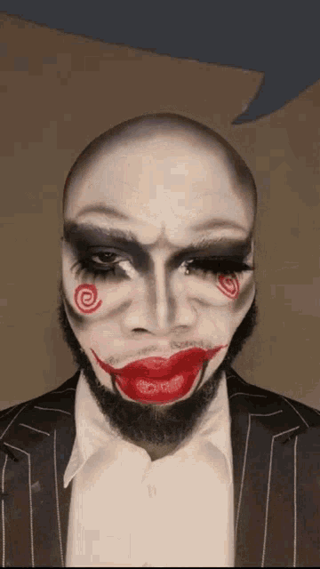 a man with his face painted like the joker