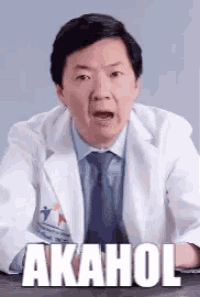 a man in a lab coat and tie says akahol .