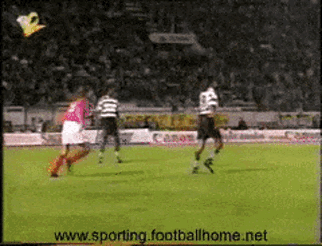a soccer game is being shown on a tv screen with the website www.sporting.footballhome.net at the bottom of the screen