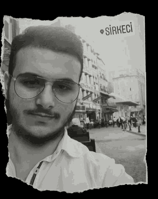 a black and white photo of a man with a sticker that says sirkeci on it