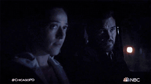 a man and a woman are sitting in a car at night with the hashtag #chicagopd on the bottom