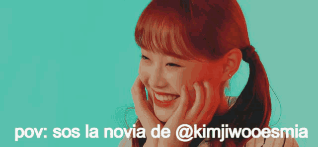 a woman with red hair is smiling with the words pov sos la novia de @kimjiwoesmia above her