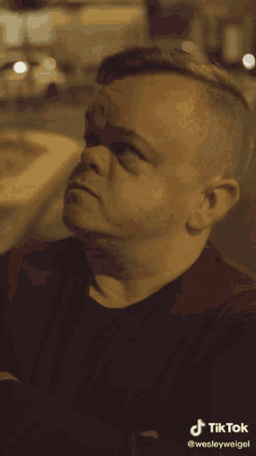 a man 's face is shown with a tiktok watermark