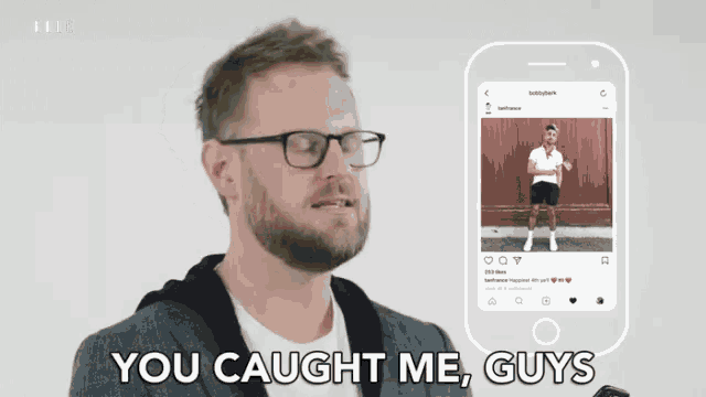 a man with glasses says you caught me guys in front of a cell phone