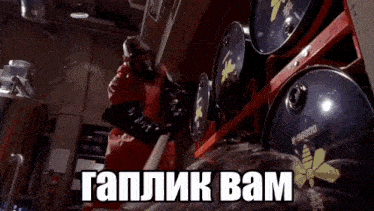 a man is standing in front of a bunch of barrels with the words " gaplik bam " on the bottom