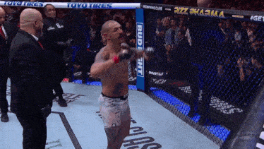 a man in a boxing ring with a banner that says bud light