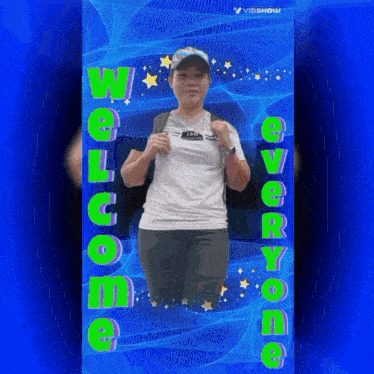 a woman in a white shirt is standing in front of a blue background with the words " welcome " written on it