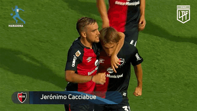 a soccer player named jeronimo cacciabue is hugging his teammate