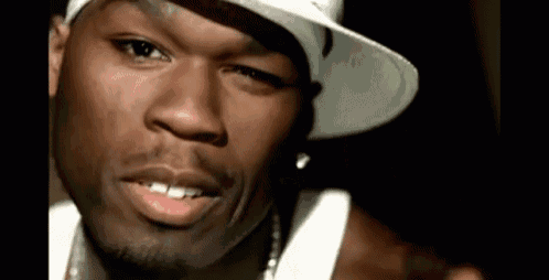 a man wearing a white hat and a white tank top