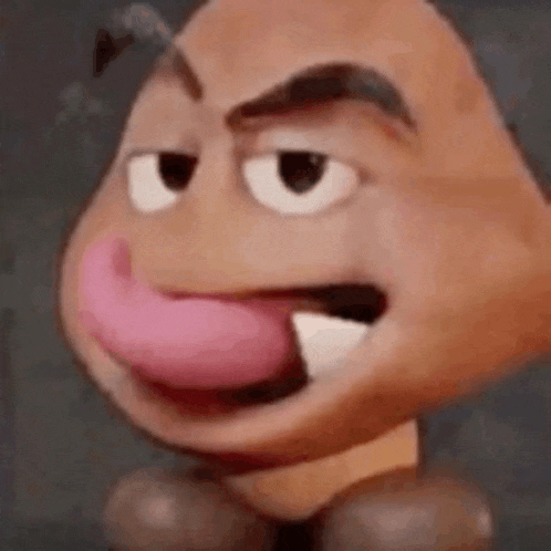 a close up of a cartoon character with a pink tongue sticking out of his mouth .