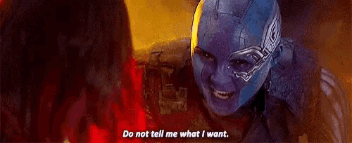 a woman in a purple helmet is talking to another woman in a purple helmet .