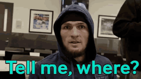 a man in a hoodie says tell me where ..